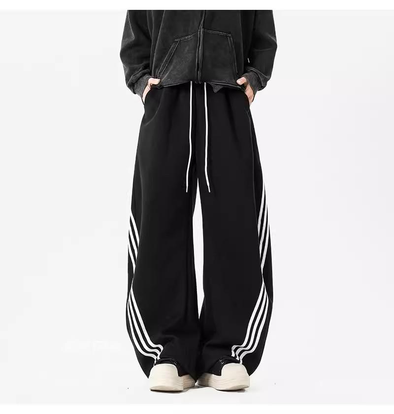 Pánské tmavě modré široké tepláky se třemi pruhy - Ležérní jarní high street trend