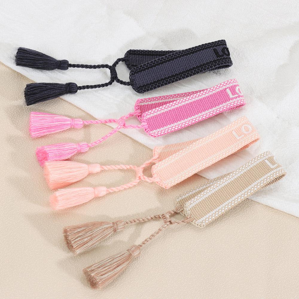 Europäisches & Amerikanisches Besticktes Freundschaftsarmband: Handgefertigter gewebter Quaste mit Logo-Schriftzug.