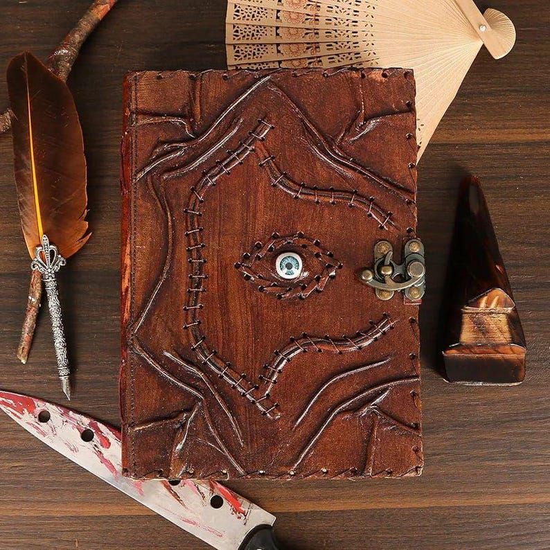 Leather Journal – Mystic Eye diary with embossed design, antique lock & unlined craft pages for writing or sketching.