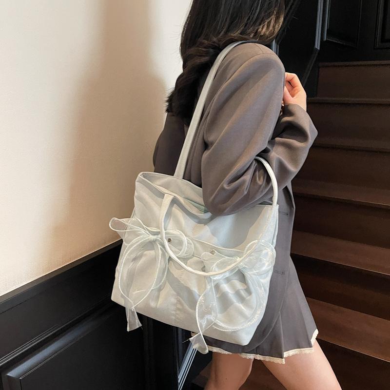 Korean version of fashionable large-capacity underarm commuter bag women's bag 2025 new bow tote bag shoulder bag