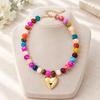 Adjustable Beaded Pendant Necklace with Rounded Resin Beads, Heart-Shaped Center Pendant, Extension Chain, and Lobster Clasp
