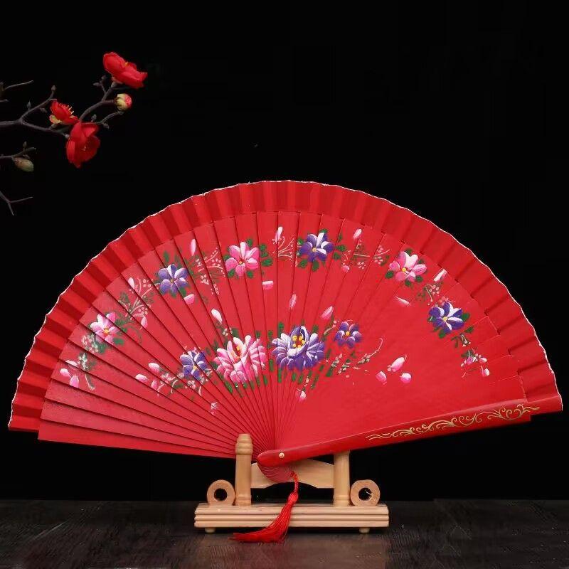 

1 шт. Красивый складной веер в китайском стиле, полый, двусторонний, ремесленный, подарок для танцев, с принтом, деревянный, испанский ручной веер, товары для вечеринок красный