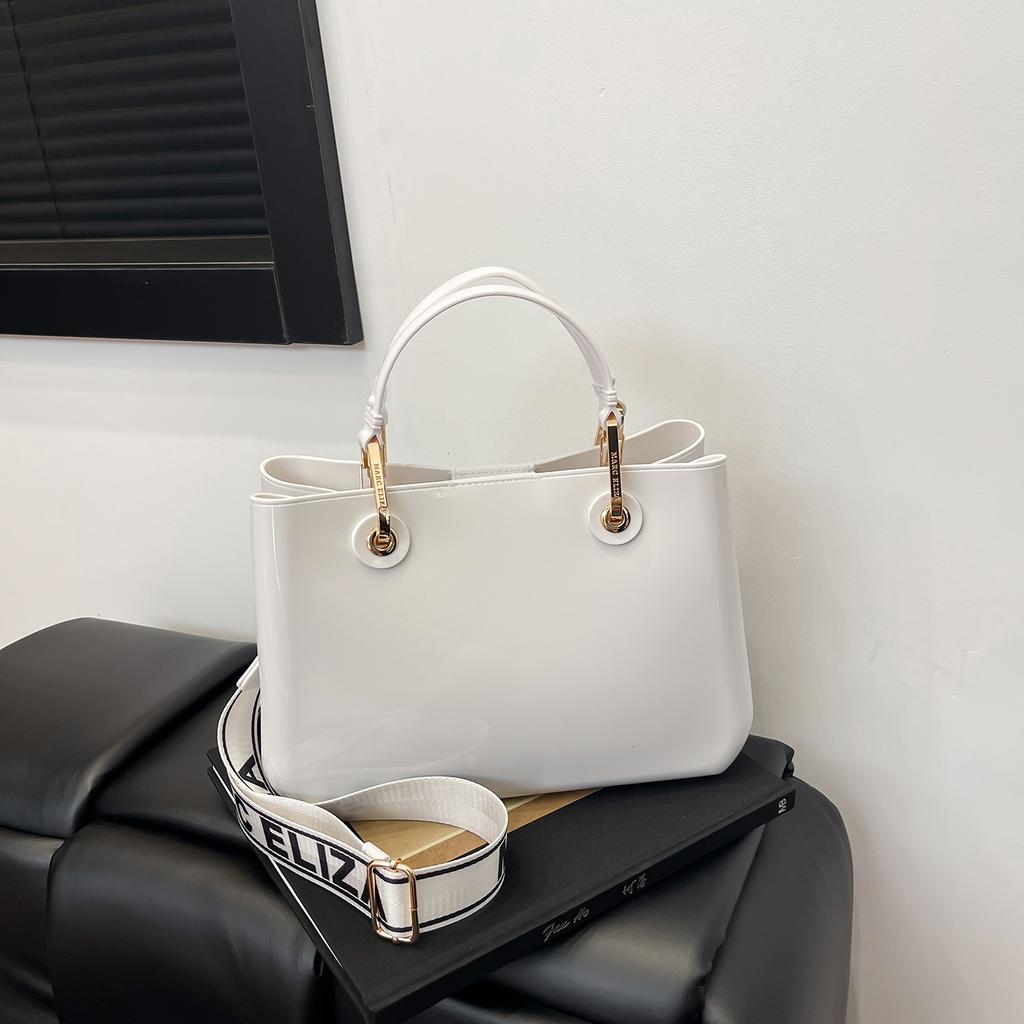 New fashion high-end sense solid color pvc commuter bag portable shoulder messenger temperament women's bag