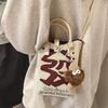 A Spacious Knitted Small Mobile Wallet with a Crossbody Strap, Suitable for Women Traveling with Small Items
