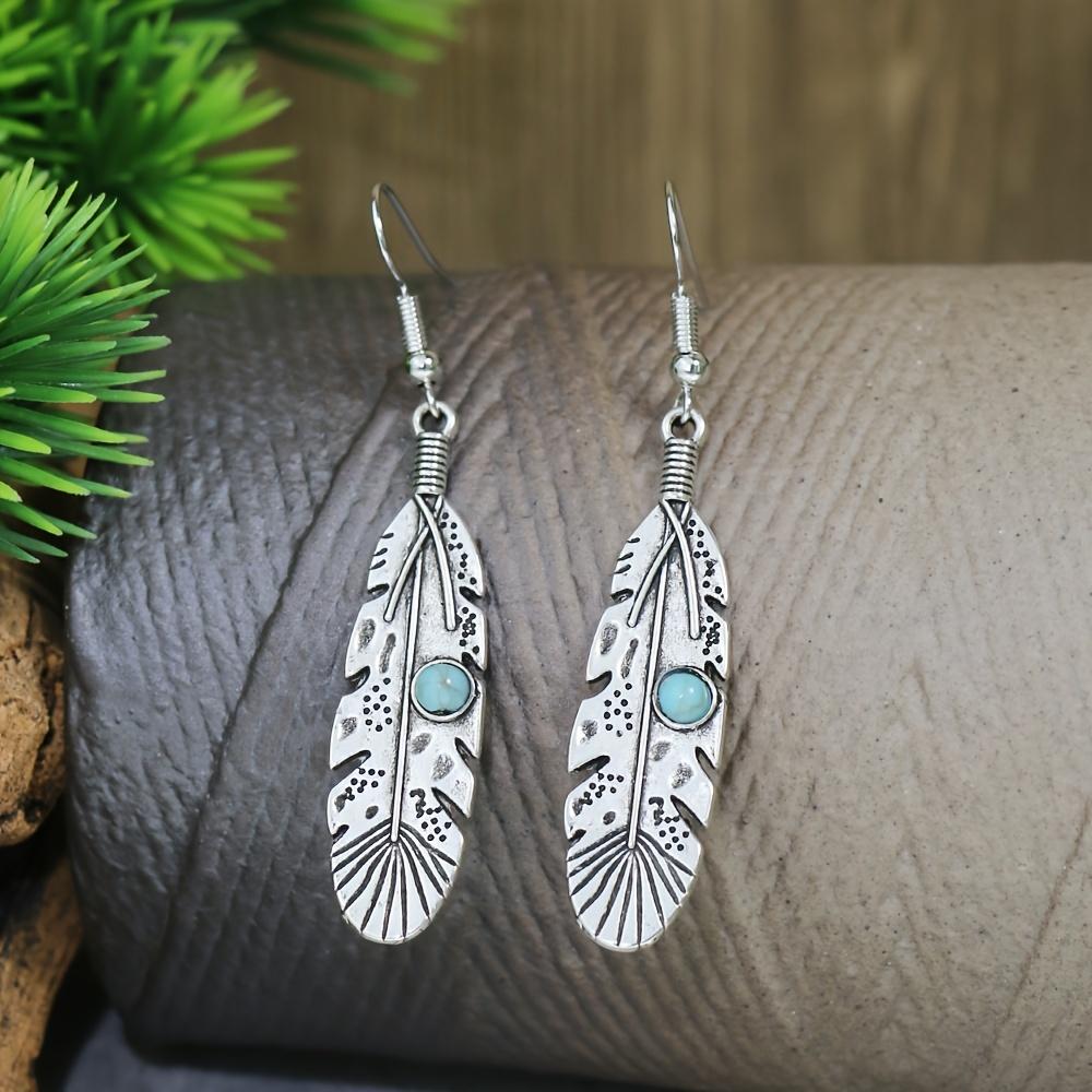 A retro ethnic-style ladies' earring and necklace set, featuring antique silver-colored leaves set in alloy and adorned with turquoise accents,