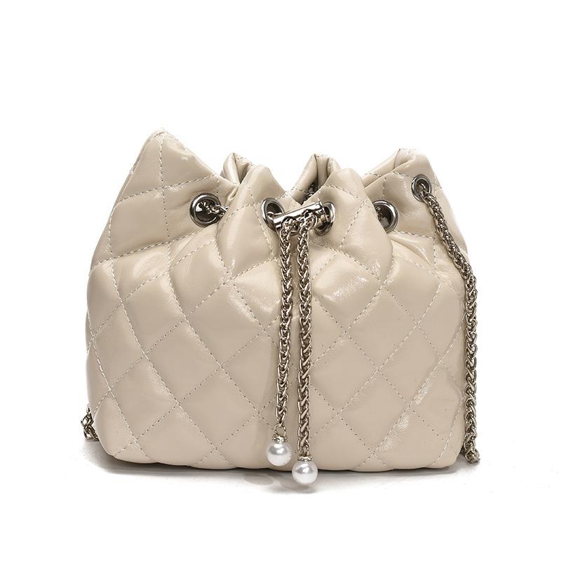 Beliebte Großhandelsnische Freizeit Rautenmuster tragbare plissierte Eimertasche Koreanische Mode vielseitige leichte Luxus Ketten Umhängetasche