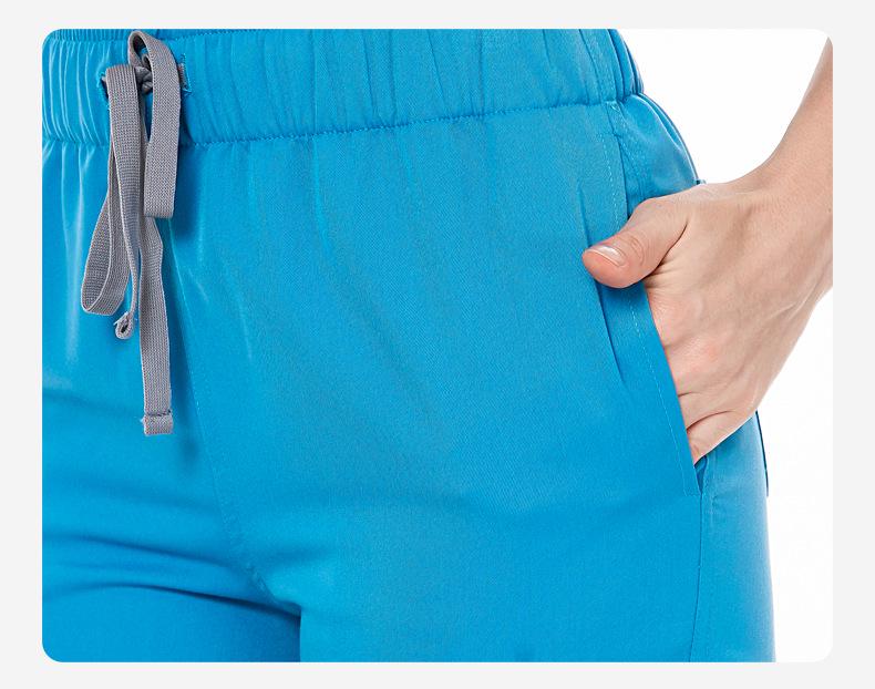 Three-Piece Nurse Scrub Set: V-Neck Jacket, Short-Sleeved Top, Long Pants with Elastic Waist.