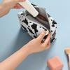 Portable Makeup Bag Cow Print Waterproof PU Toiletry Bag Fashionable Zipper Makeup Pouch for Travel