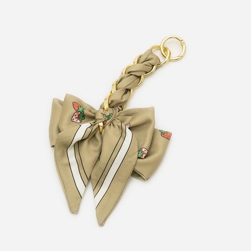 Elegant Hand-Woven Scarf Chain with Bow Decoration Pendant for Bag Strap Modification.