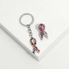 Creative and unique pink ribbon brooch keychain alloy drip pendant D1282