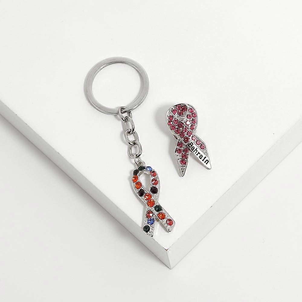 Creative and unique pink ribbon brooch keychain alloy drip pendant D1282