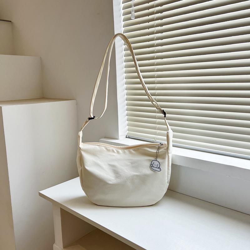 

New women s bag summer student large-capacity simple casual shoulder messenger bag trendy fashion canvas tote bag бежевый