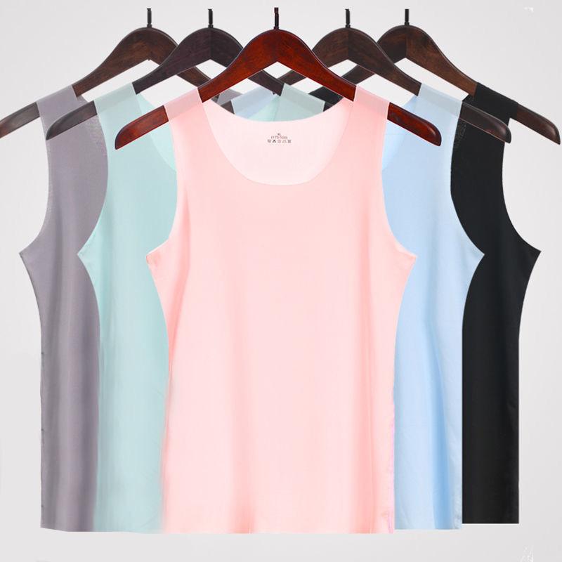 Haut d'été sans coutures à fines bretelles pour femme, polyvalent et sans manches, idéal comme base pour une coiffure tendance.