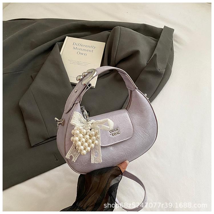 Super fire small bag women 2025 new hand carry crescent bag commuter messenger bag one shoulder armpit dumpling bag