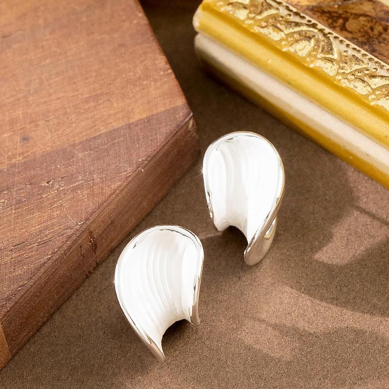 

French light luxury fashion oil painting style white paint irregular geometric stud earrings women s high-end simple earrings