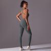 Sömlös enfärgad yogajumpsuit med öppen rygg