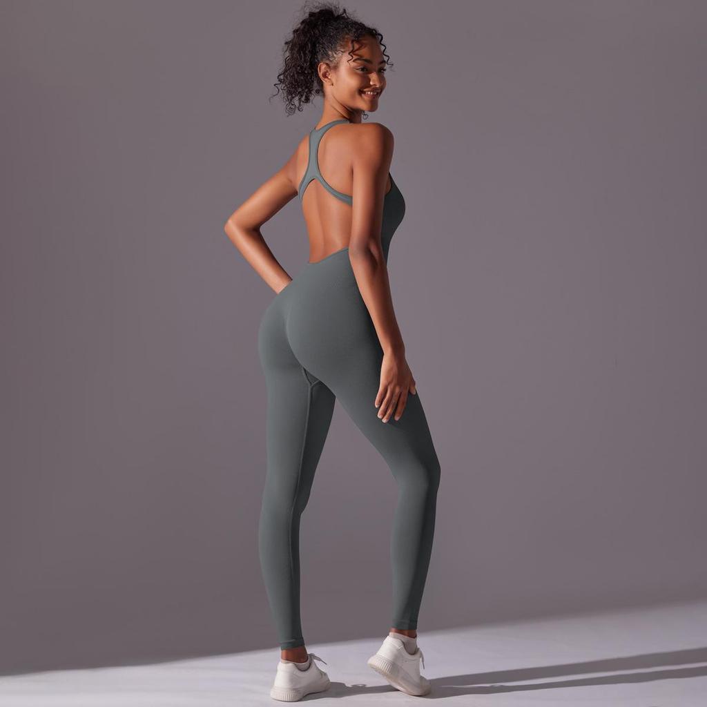 Sömlös enfärgad yogajumpsuit med öppen rygg