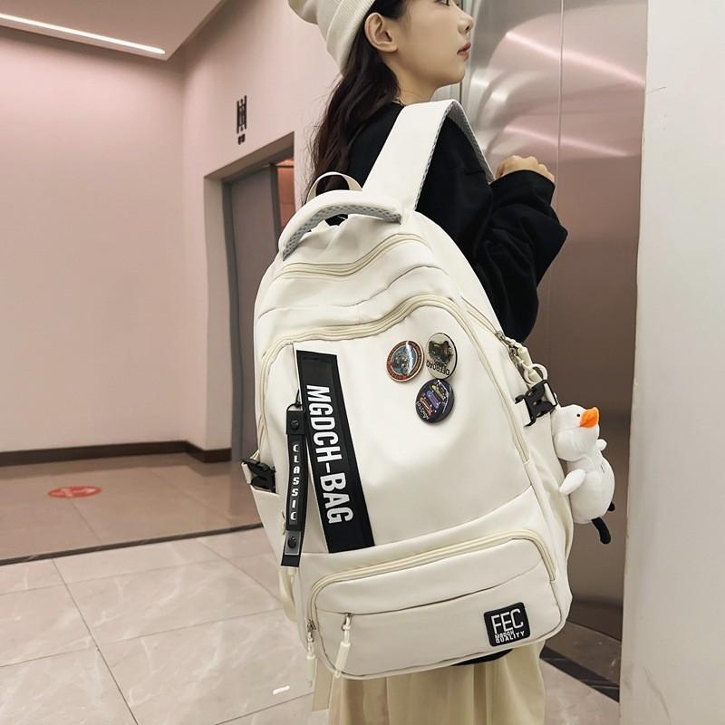 

Trendy Badge Couple Backpack High School College Students Travel Bag Men s Large Capacity Casual Shoulder Bag білий