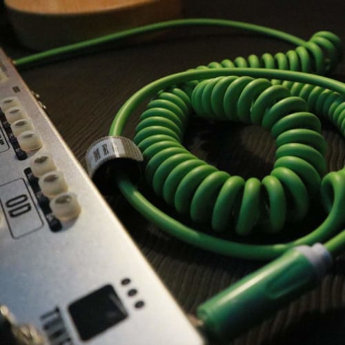 Aestivate 10m Coiled Guitar Cable with Bass Shield and 6.35mm Stereo Plug for Instruments (Green)