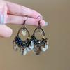 Retro ethnic style round hollow earrings Bohemian temperament elegant earrings niche fashion light luxury earrings women
