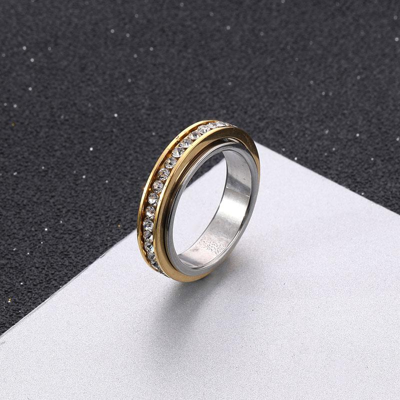 Anillo de pareja de acero inoxidable giratorio con diamantes de dos colores, sencillo, de moda, de titanio y acero, para parejas