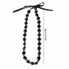 Collana di noci di kukui - Laurea Classe 2023 - Ghirlanda di noci con perline nere e fiocco - Regalo di laurea - Accessorio per feste