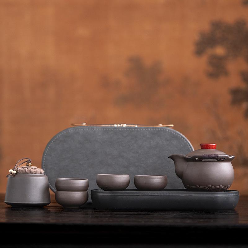 Purple sand hand-held pot travel tea set with tea tray, portable outdoor one pot and four cups of express cup as a gift.