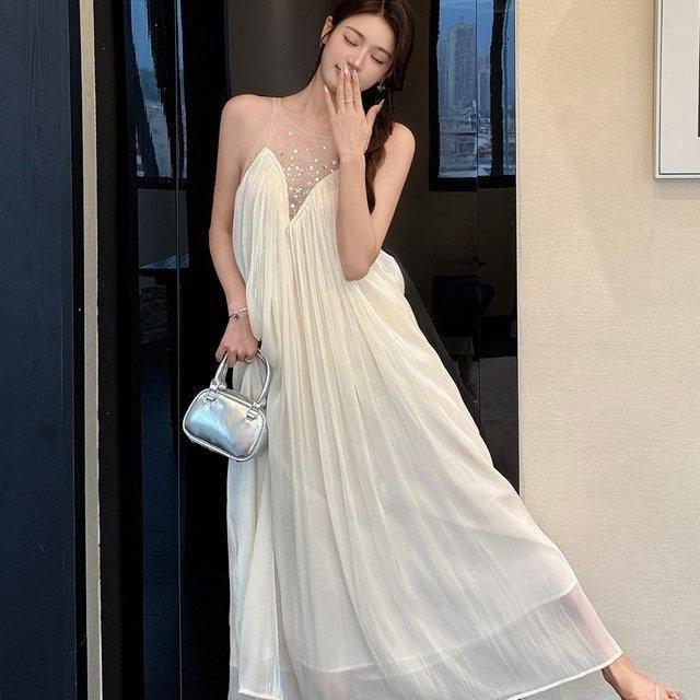 French white romantic sleeveless dress women's clothing early summer fairy fluttering high-end feeling beautiful seaside vacation skirt