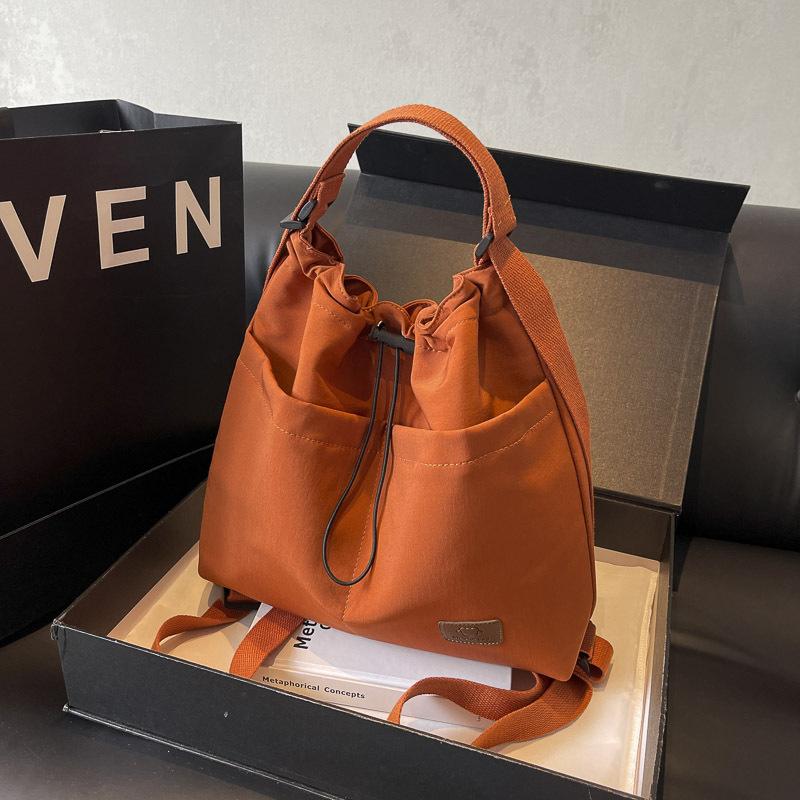 2025 new large-capacity casual fashion drawstring pleated shoulder bag travel leisure messenger tote bag women