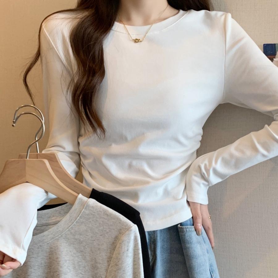 Spring new solid color bottoming shirt women's card waist pleated front shoulder long-sleeved shirt curved hem inner top