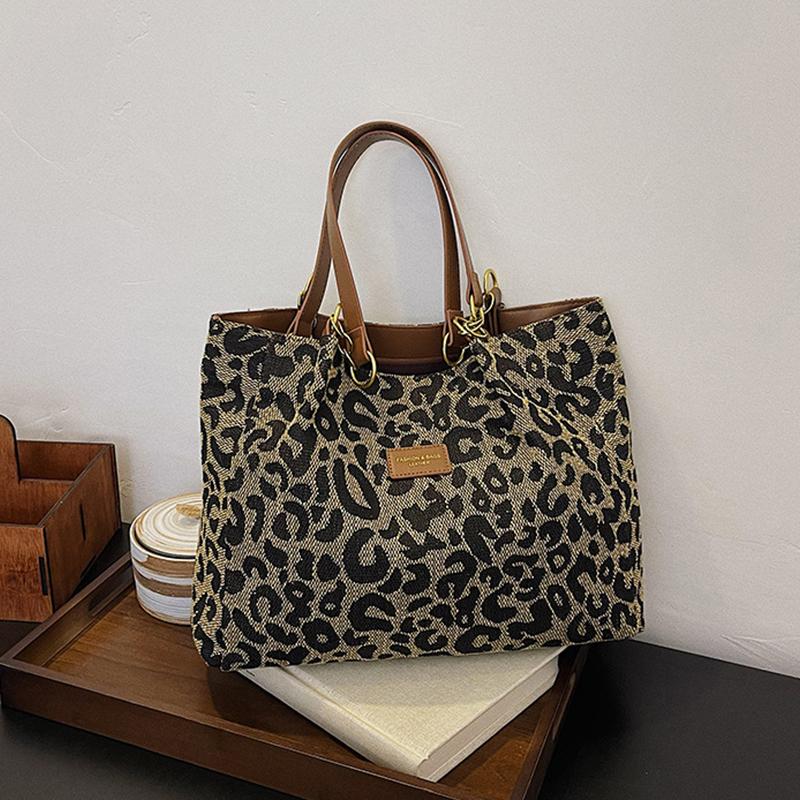 Neue modische Tragetaschen aus Segeltuch zum Einkaufen und Reisen. Neue beliebte Handtaschen für Damen mit großem Fassungsvermögen und Leopardenmuster, Umhängetaschen