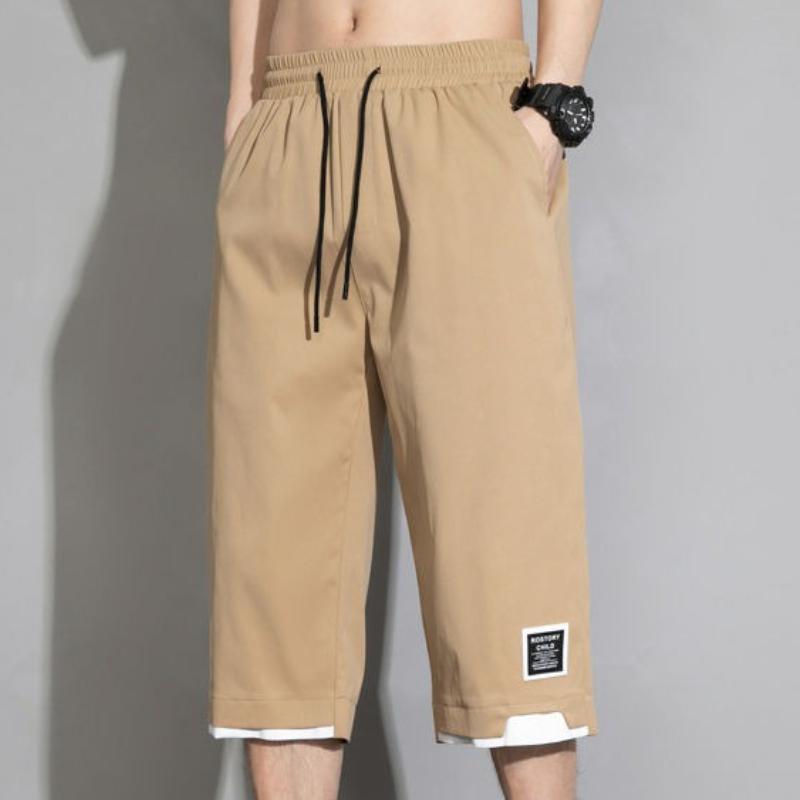 

Летние мужские универсальные повседневные шорты Koreon, уличная одежда, модные мешковатые брюки с эластичной резинкой на талии цвета хаки, черные, зеленые, большие размеры, капри, 8XL M