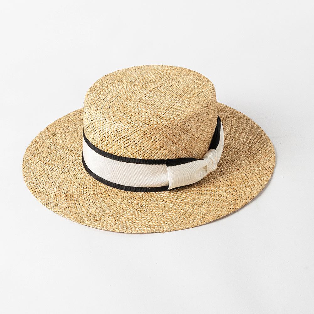 Spring and summer new fashion two-color webbing bow treasure grass wide brim flat top hat outdoor shopping sun protection straw hat