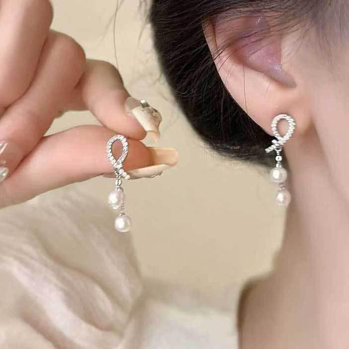 Koreanischer Stil Nicht-Piercing Ohrclip mit langem Quaste, Perlmutt Schmetterlings Design für Damen - High-End, Coole Mode.