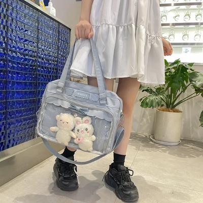 Japanische süße transparente Canvas-Mode für Mädchen, eine Schultertasche, Studenten-Persönlichkeit, Umhängetasche mit Abzeichen, Puppentasche