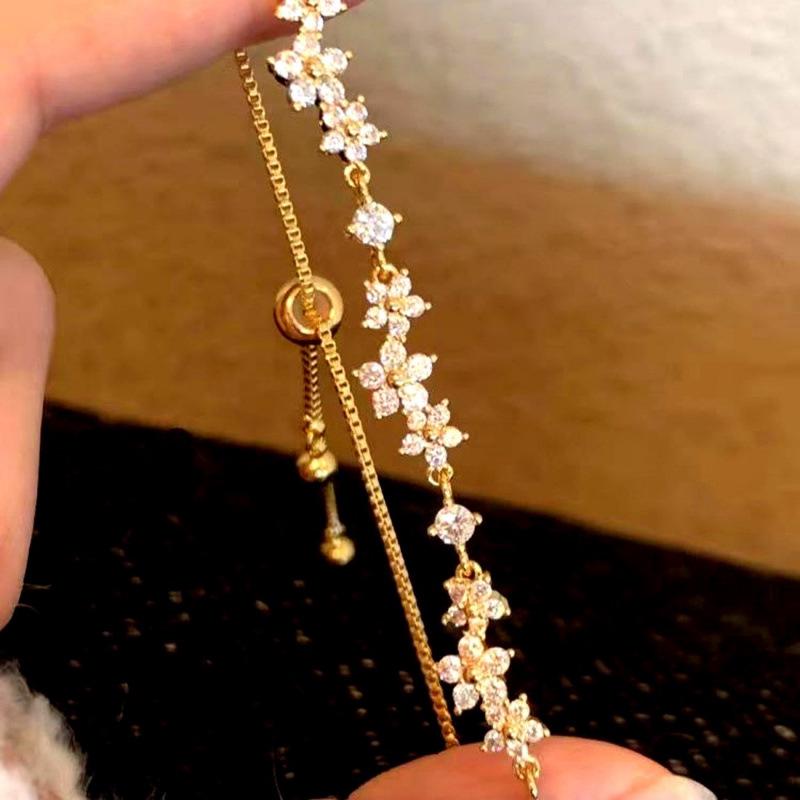 Trendy Micro-Paved Zirconia Flower Bracelet for Women, Adjustable Pull-String Style, Influencer Inspired Hand Jewelry