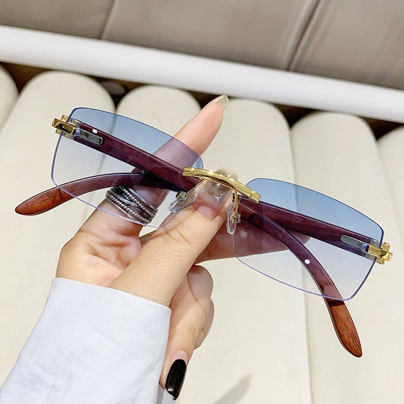 New frameless trimmed personalized sunscreen sunglasses catwalk travel fashion versatile wood grain legs advanced sunglasses