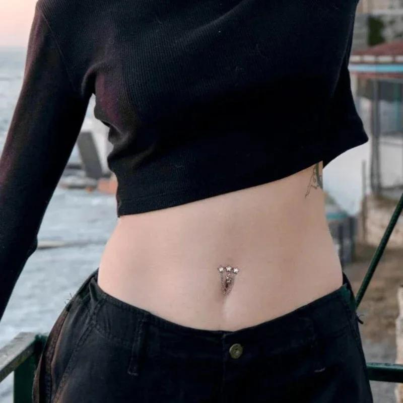 1pc woman with a stainless steel navel featuring stars and the moon design, and a vintage perforated navel nail wearing jewelry
