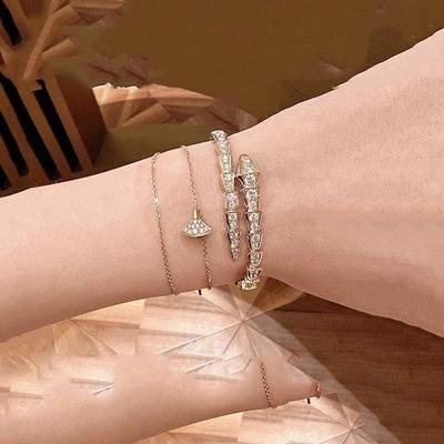 Bracciale rigido lussuoso a osso di serpente placcato oro rosa 18k con diamanti per donna