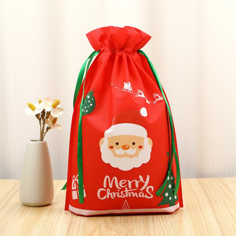 

50 шт. Новый нетканый рождественский мешок-сюрприз Подарочный пылезащитный упаковочный пакет Санта-Клаус Сумки для хранения с двойным шнурком 27x36cm 50pcs красный