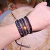 Bohemian style, hand-woven leather cord bracelet with natural black agate - vintage five-layer design, suitable for everyday wear and vacations.