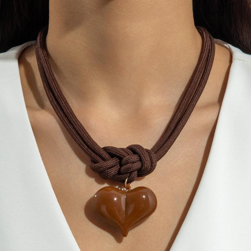 A Unique Knotted Design Necklace With Leaves Starfish And Scallops A Simple Drawstring Pendant Necklace With A Bow And Pearls