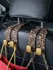 2Pcs Leopard Print Car Seat Hooks, Gold Alloy Buckle PU Leather Hanger for Bag Phone, Universal Auto Interior Accessories