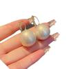 Hong Kong style elegant temperament pearl earrings women's ear buckle type niche unique design earrings European and American cold wind earrings