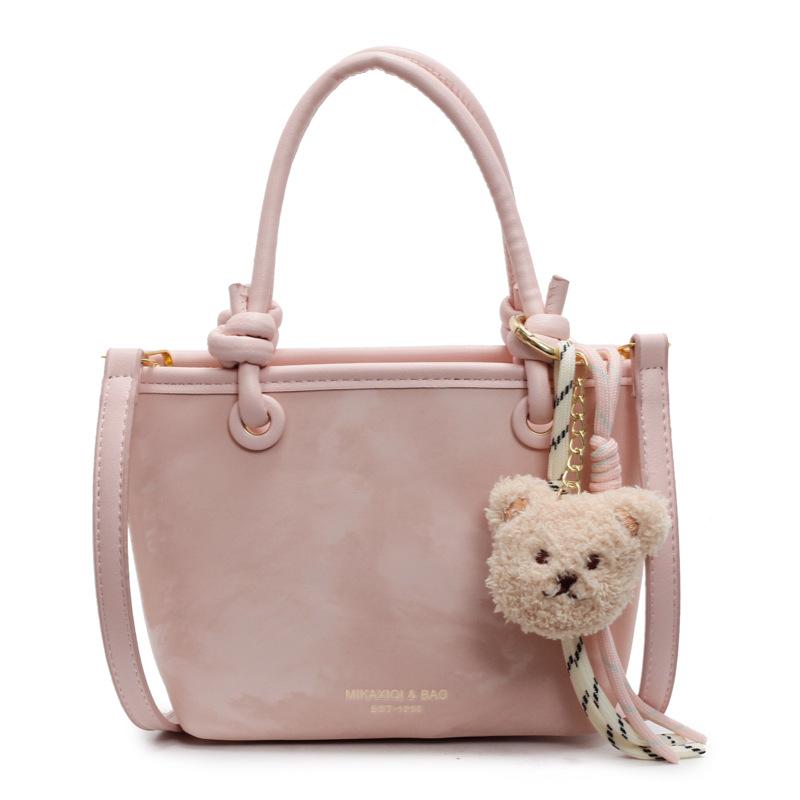 Korean version ins trendy personality contrasting colors casual hand carrying bucket bag fashion high sense versatile temperament messenger bag woman