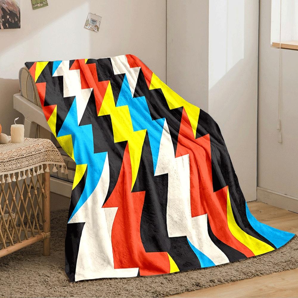 Zigzag lightning shapes in bold colors, including red, yellow, blue, and black. for all seasons blanket lunch break throw gift