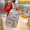 Jugendrucksack mit Sanrio Kuromi Süßes Schleifenmuster für den Campus