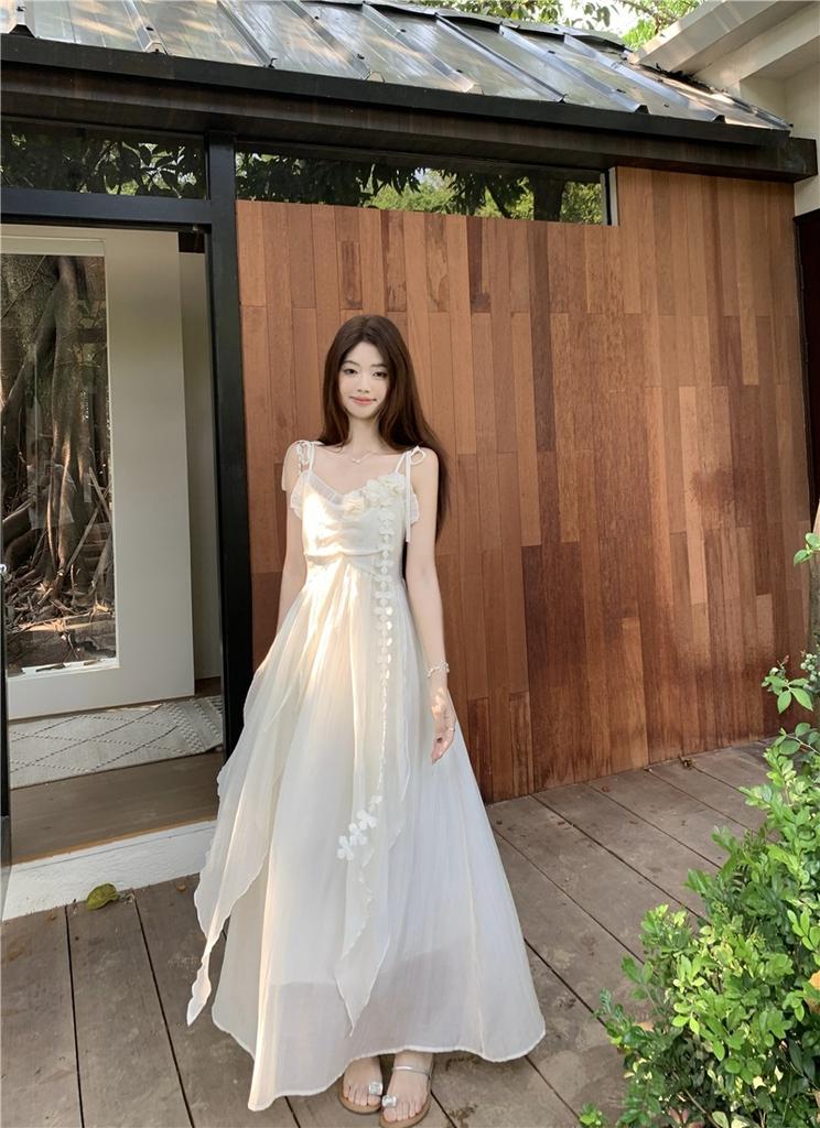 Holiday style flower design suspender dress women's 2026 summer new waist thin very fairy long skirt