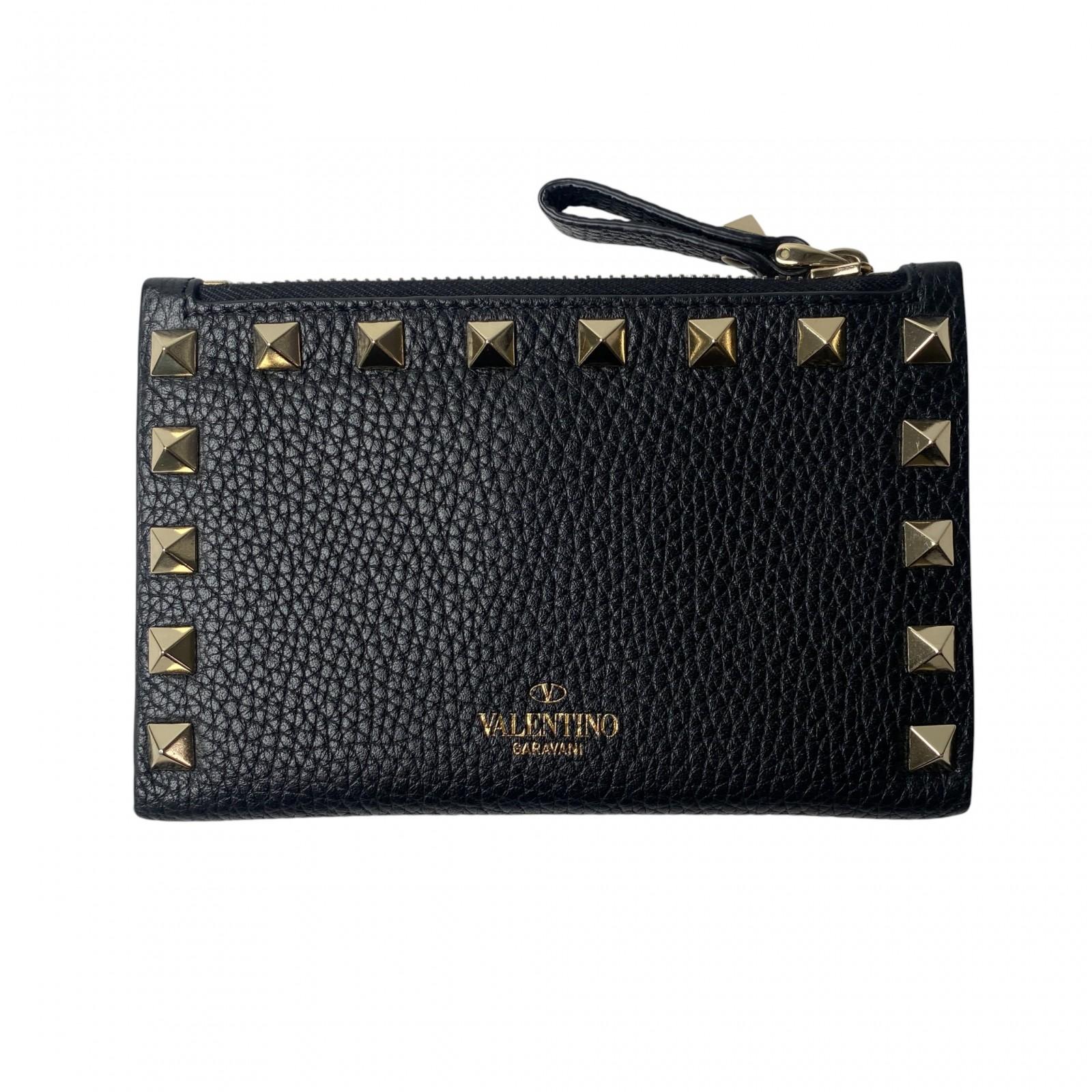 

Вживаний гаманець Valentino Garavani біфолд чорна/золота шкіра Жіночий