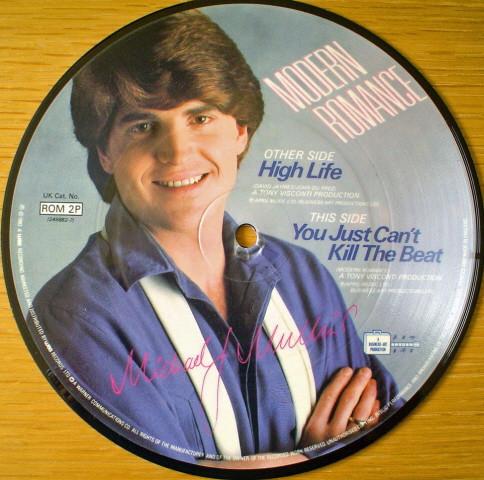 

7-дюймовая пластинка MODERN ROMANCE - High Life / You Just Can t Kill The ROM2P WEA 1983 UK Танцевальная и электронная Б/У